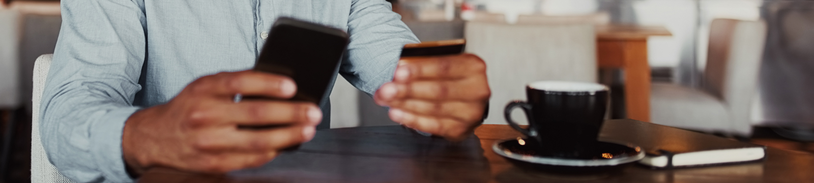 Man using credit card with smartphone